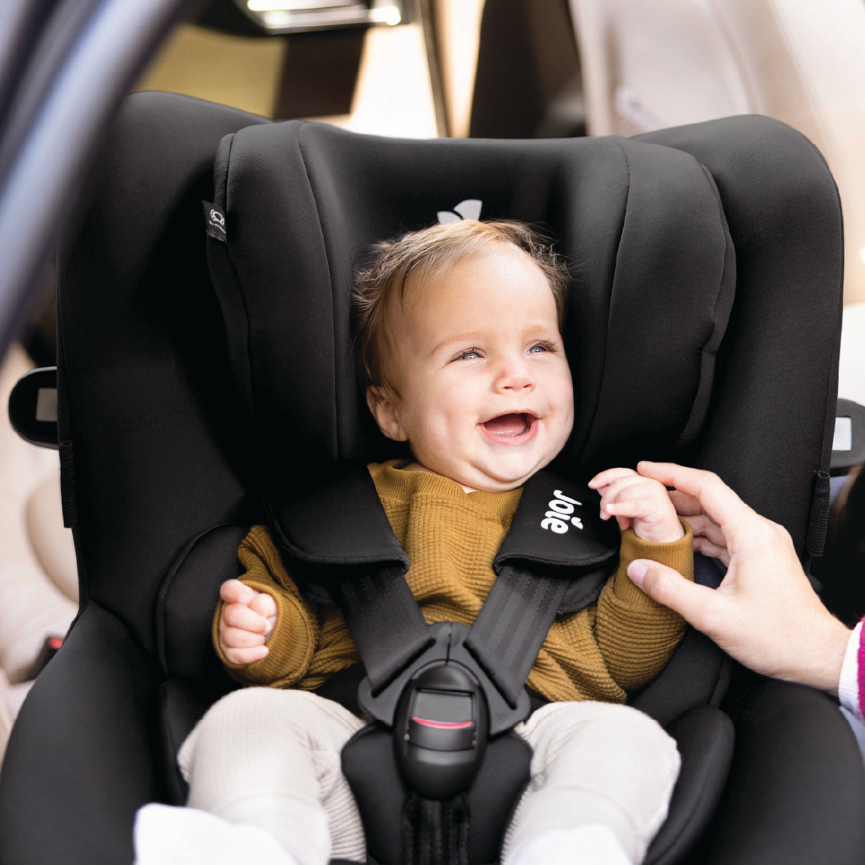 Joie car seats collection featuring infant carriers, rotating ISOFIX seats and high-back boosters designed for safe and comfortable travel from newborn to child.