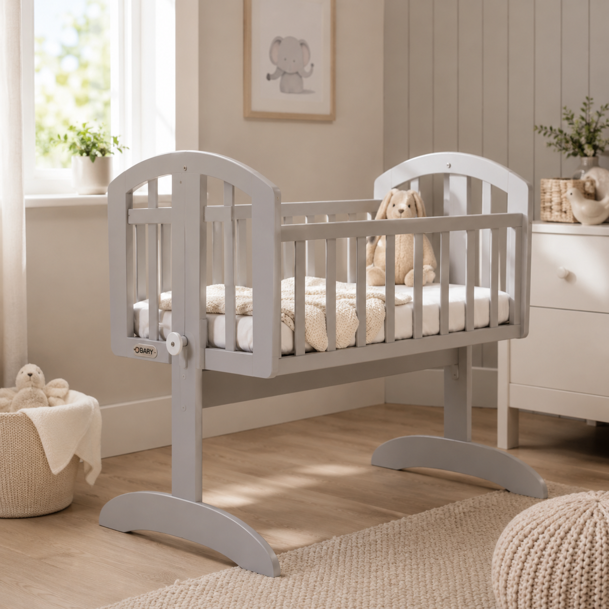 Grey bedside crib in a modern nursery