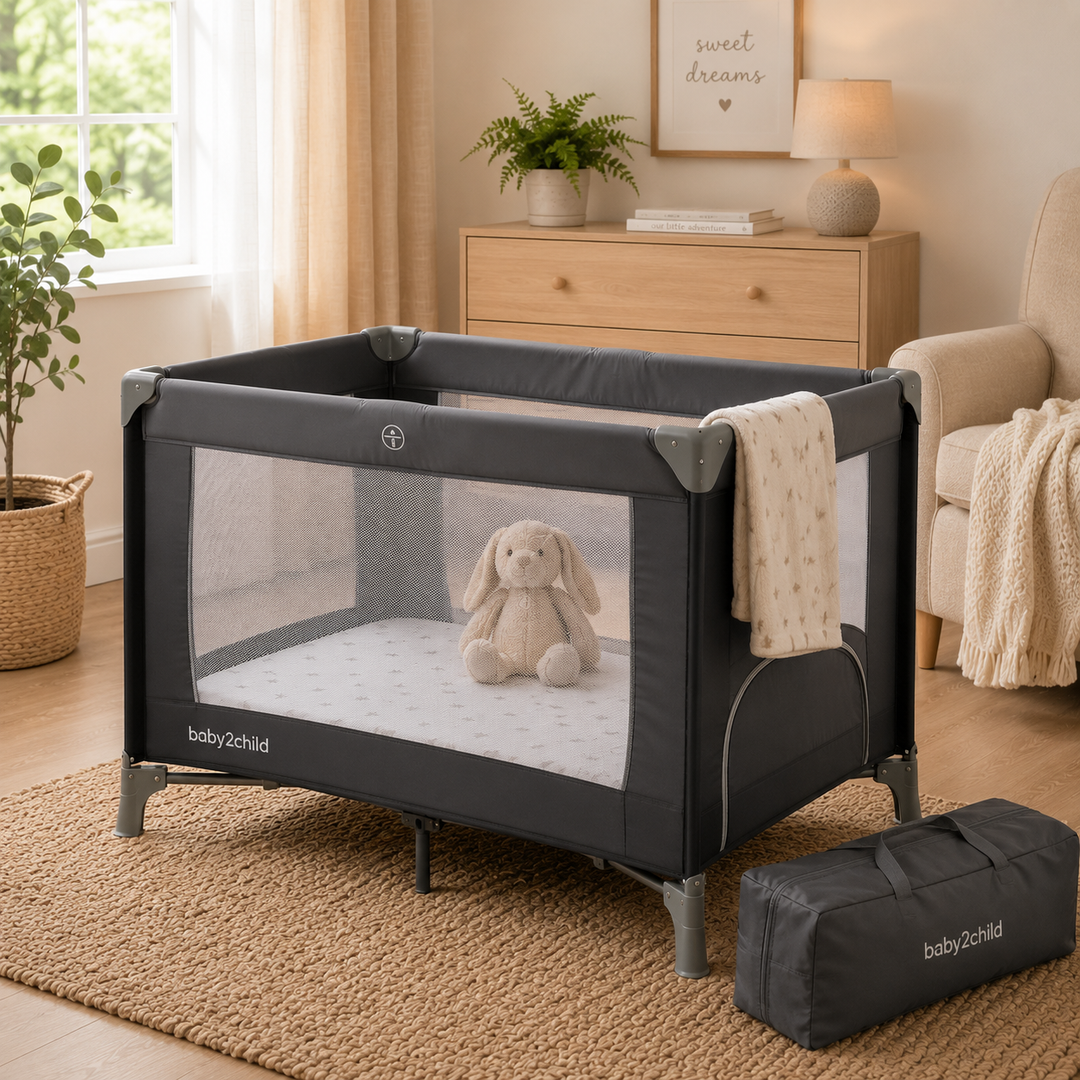 Modern travel cot in a cosy nursery