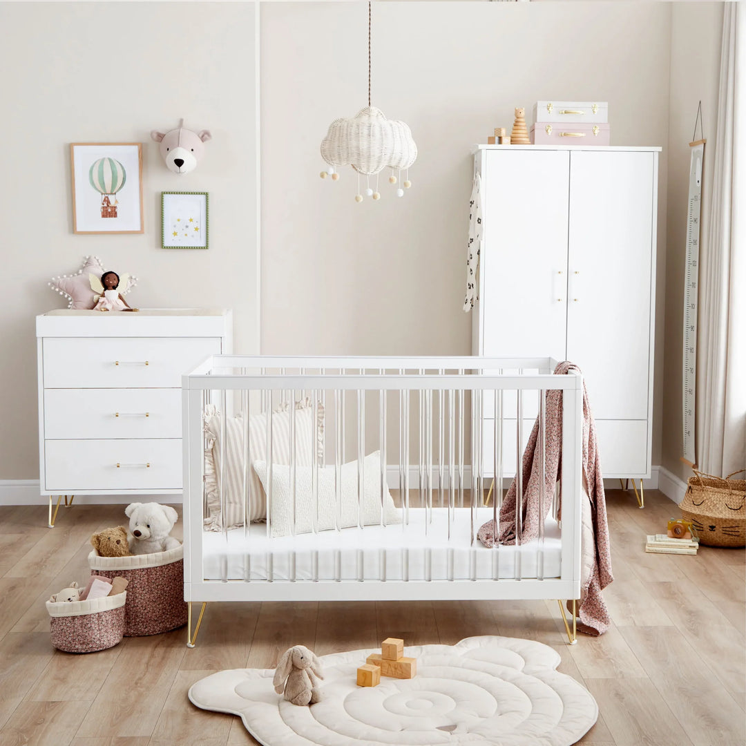 Furniture set collection featuring coordinated nursery and children’s bedroom furniture including cot beds, wardrobes, and dressers in a stylish home setting