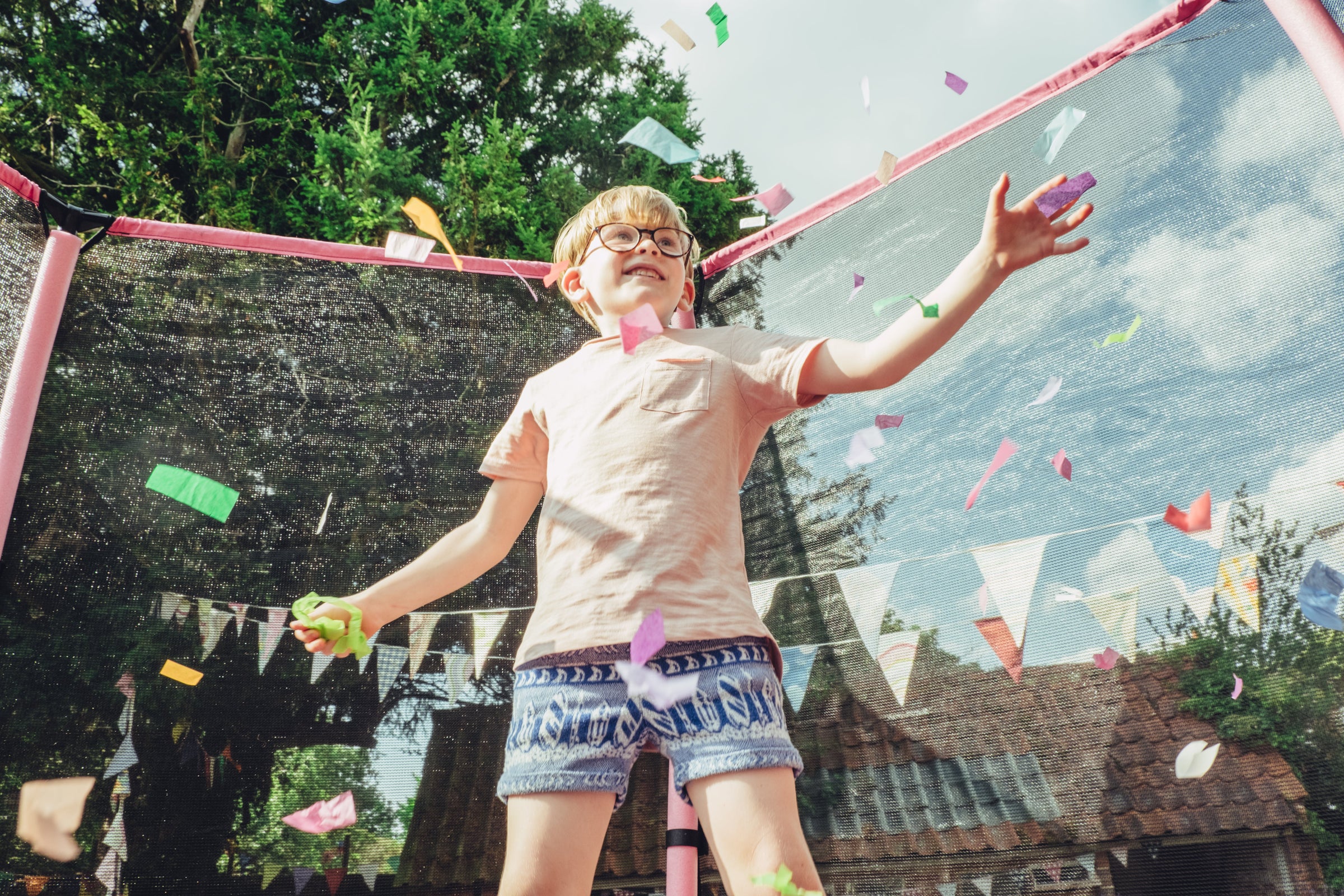 Plum trampolines in garden with safety enclosures, including junior and large outdoor trampolines for kids