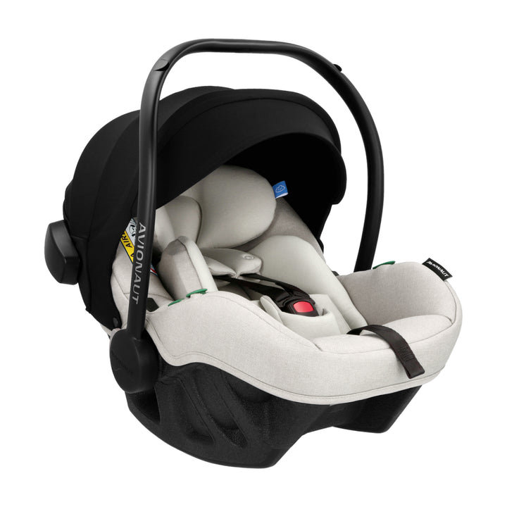 Baby car seat with black canopy and white seat on a white background