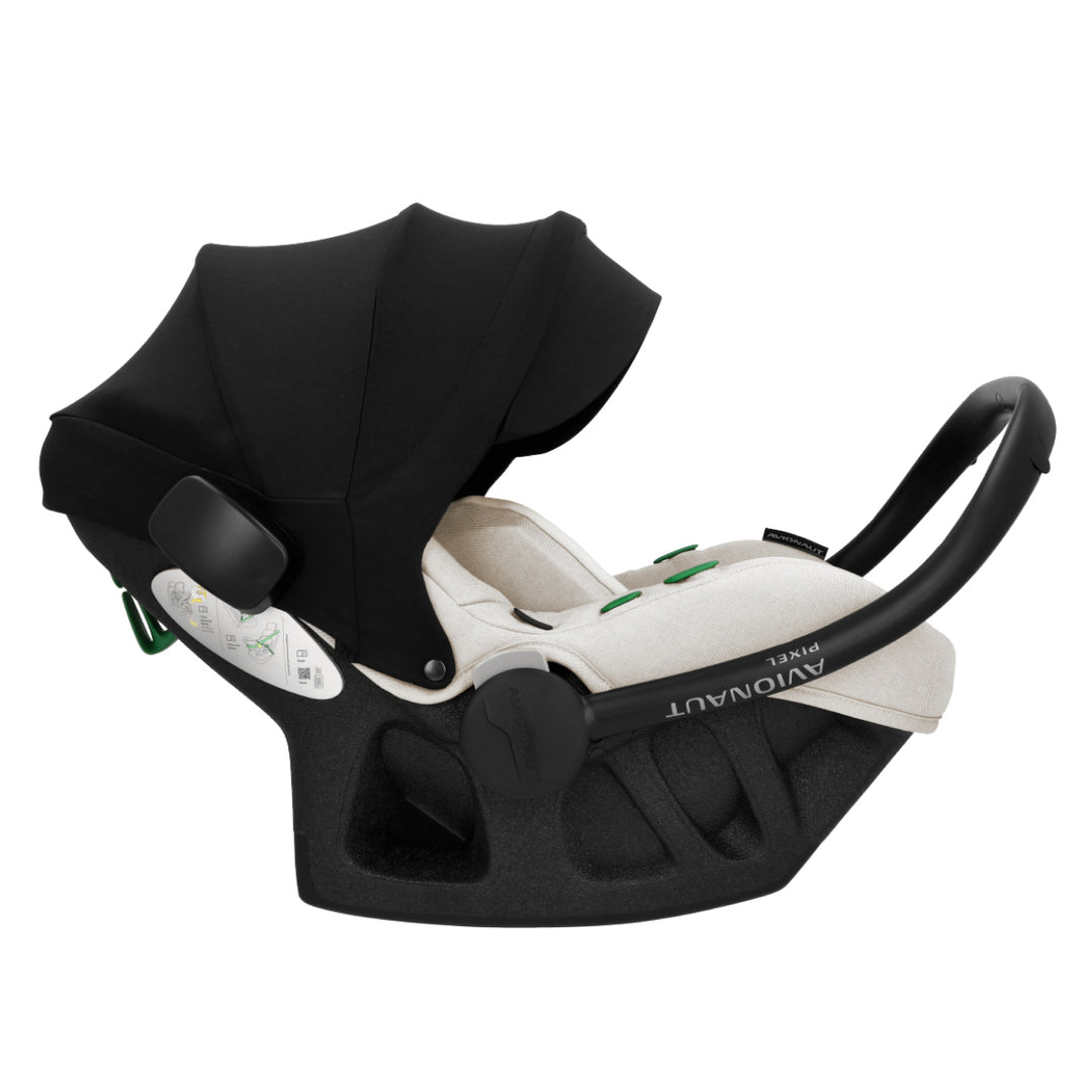 Black and white baby car seat with canopy on a white background