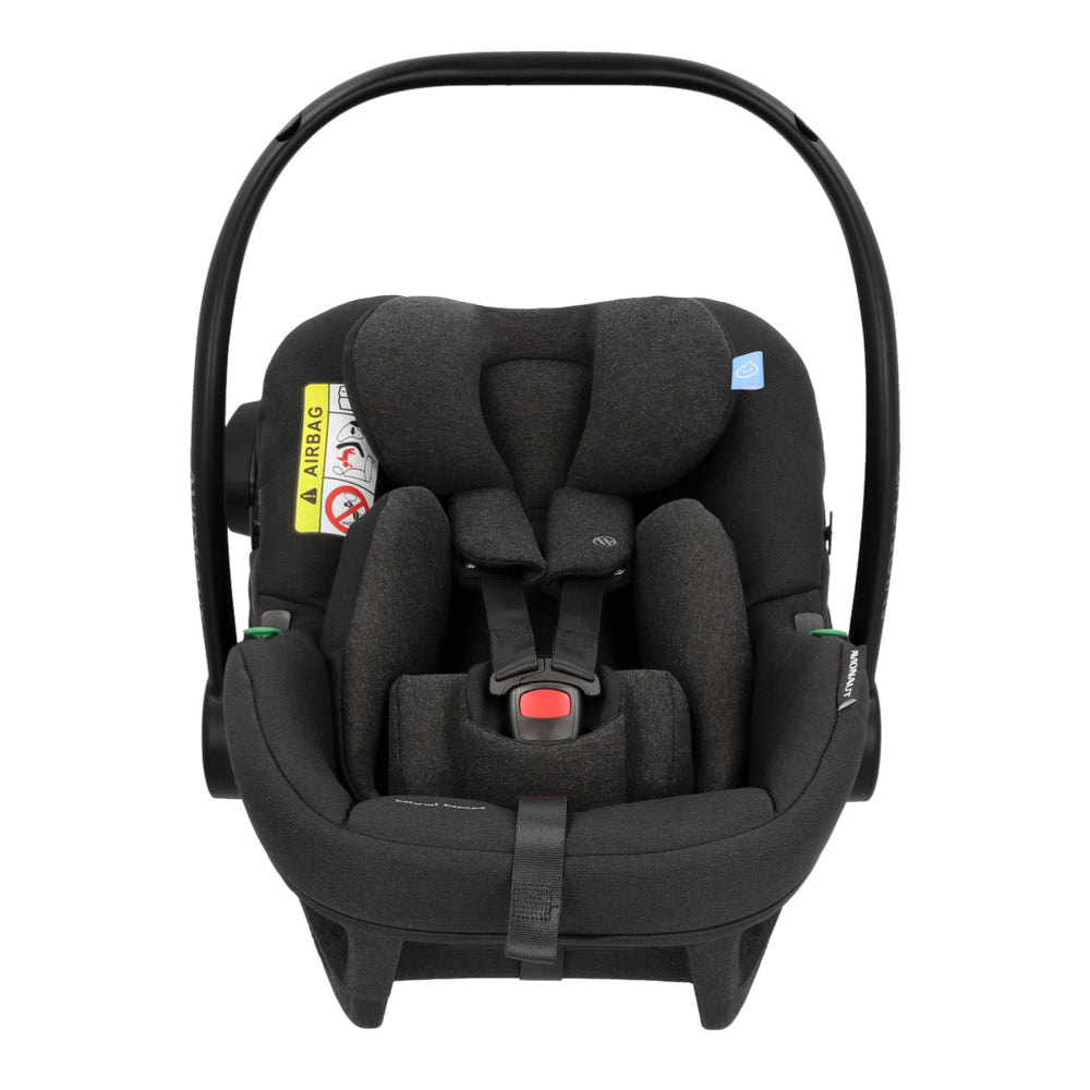 Black baby car seat with safety labels on a white background