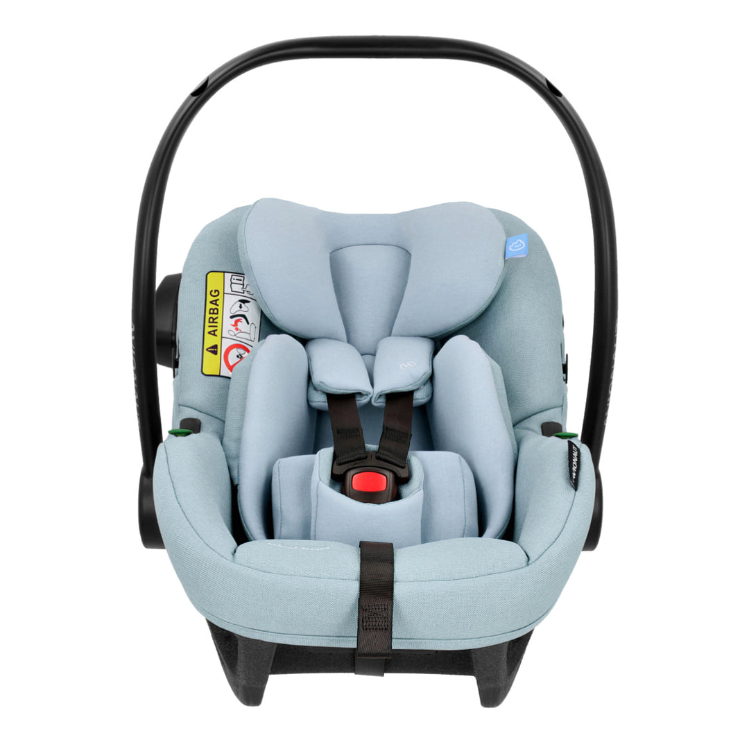 Light blue baby car seat with black straps on a white background