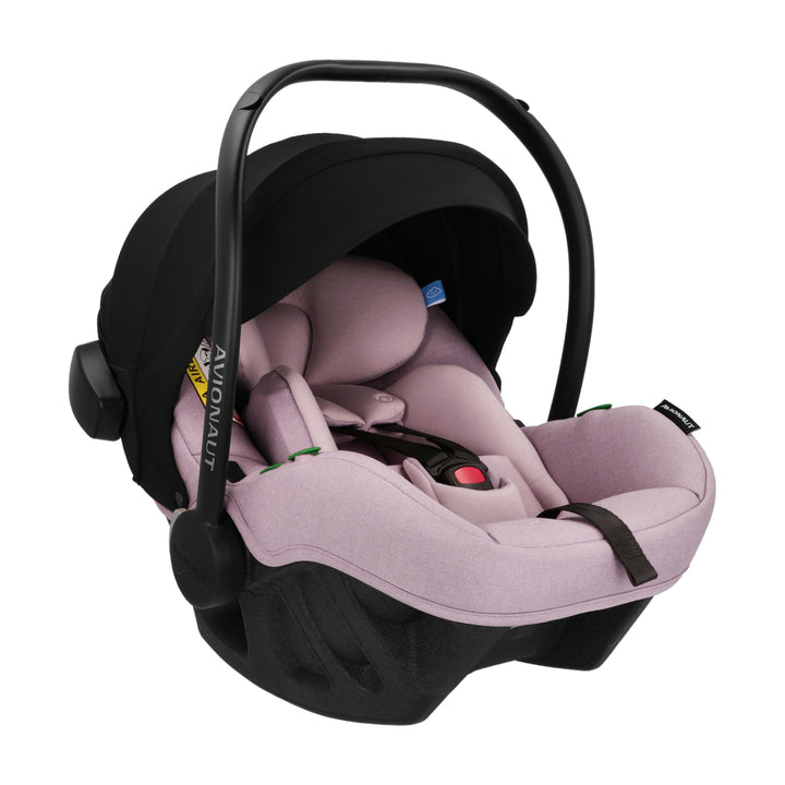 Baby car seat with black frame and pink cushion on a white background