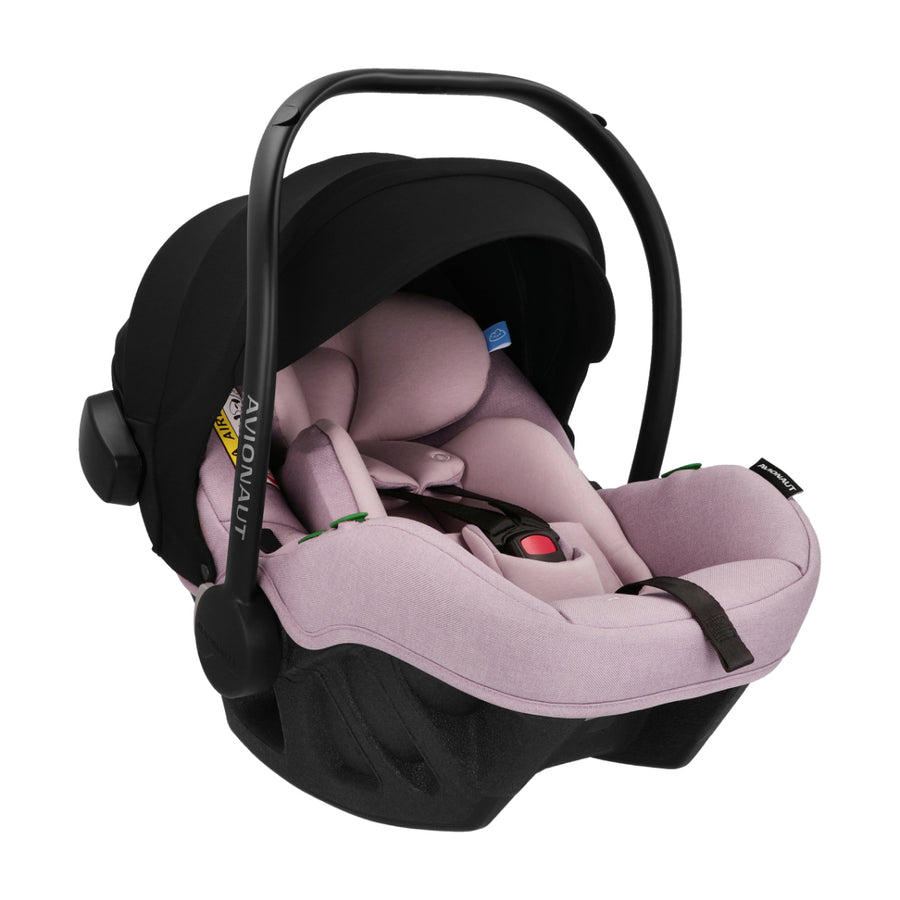Baby car seat with black frame and pink cushion on a white background