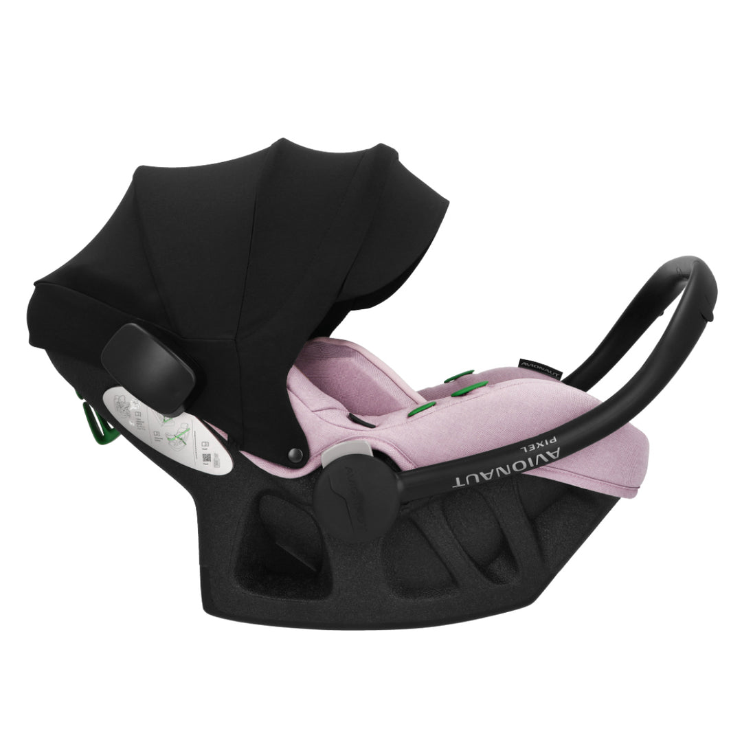 Black baby car seat with pink interior on a white background