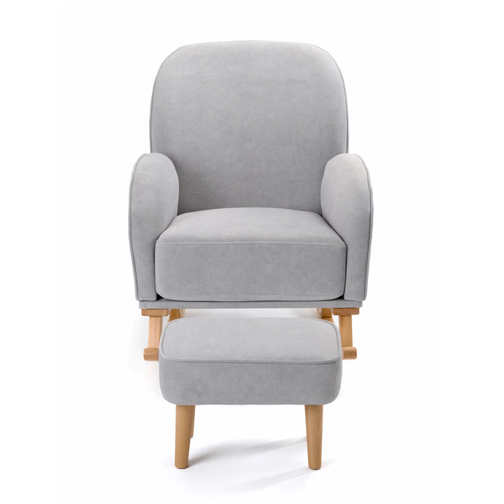 Grey armchair with matching ottoman on a white background