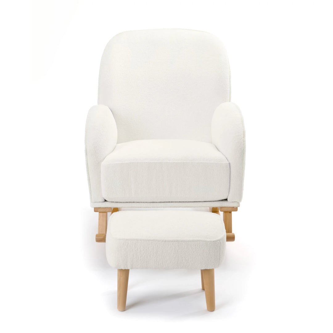 White armchair with matching ottoman on a white background