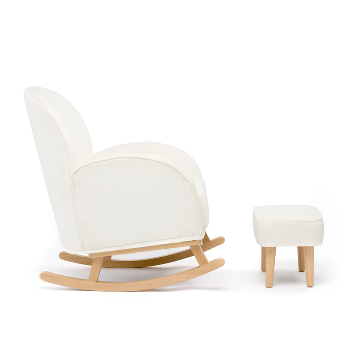 White rocking chair with wooden legs and matching ottoman on a white background