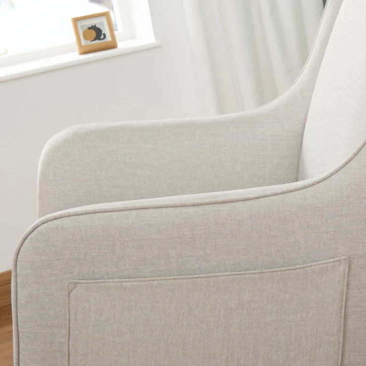Close-up of a light chashmere upholstered nursing chair