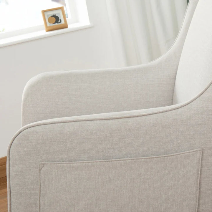 Close-up of a light chashmere upholstered nursing chair