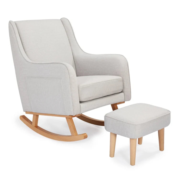 Chasmere rocking chair with wooden legs and matching ottoman on a white background