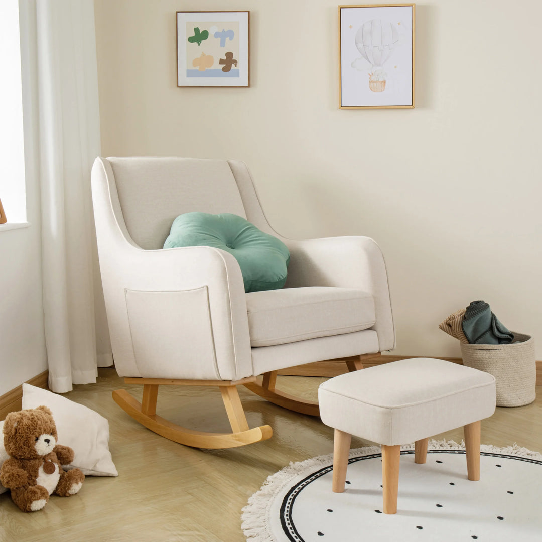Ivory rocking chair with a green cushion in a nursery setting
