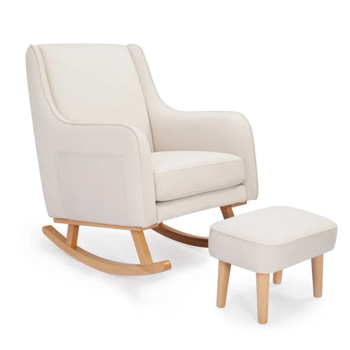 Ivory rocking chair with matching ottoman on a white background