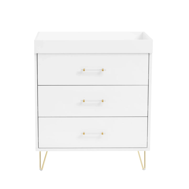 White dresser with gold legs and handles on a white background