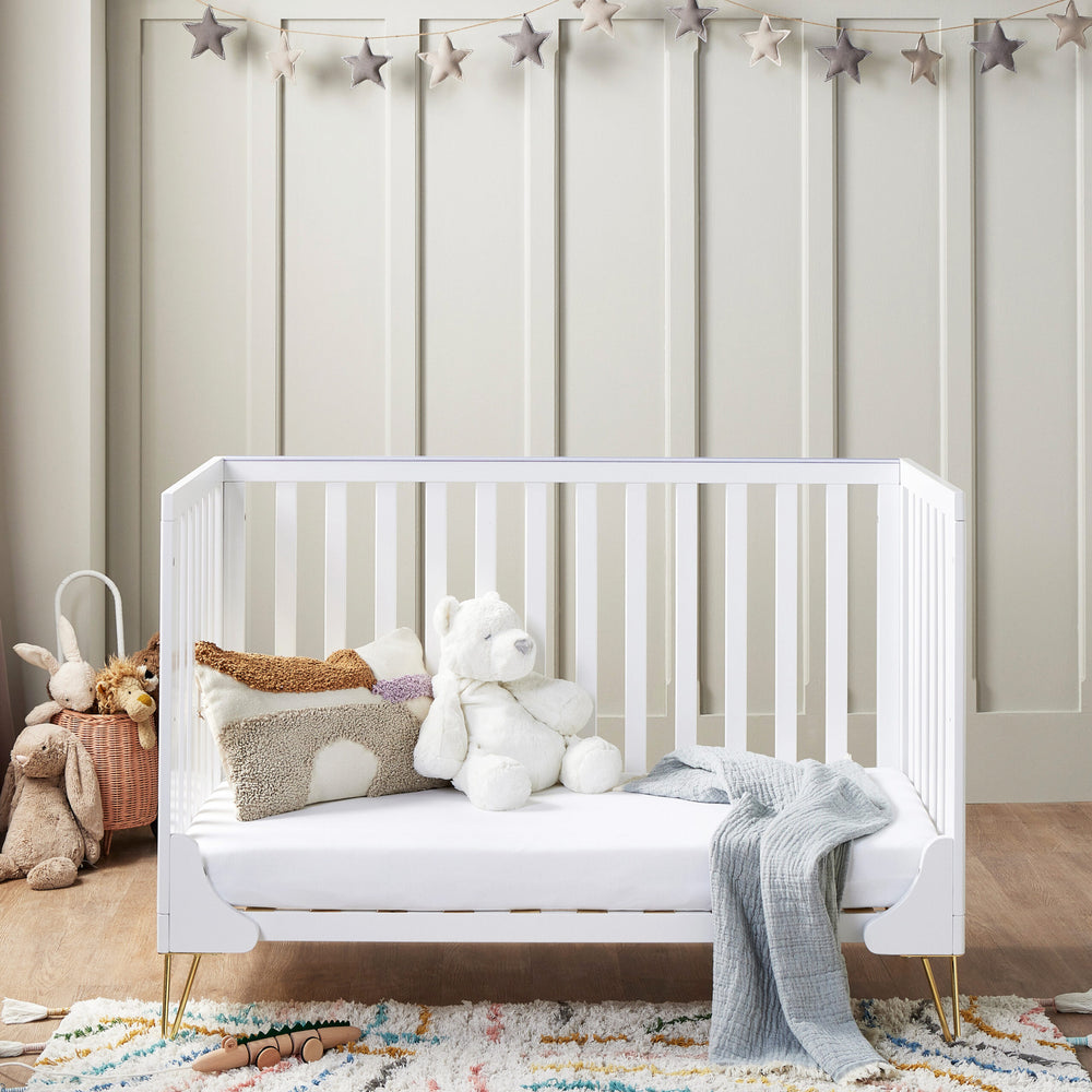 Babymore Kimi Cot Bed – White nursery setting