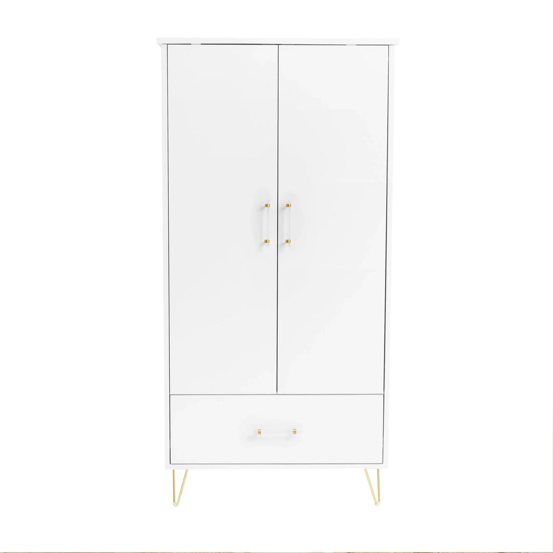 White cabinet with gold legs and handles on a white background