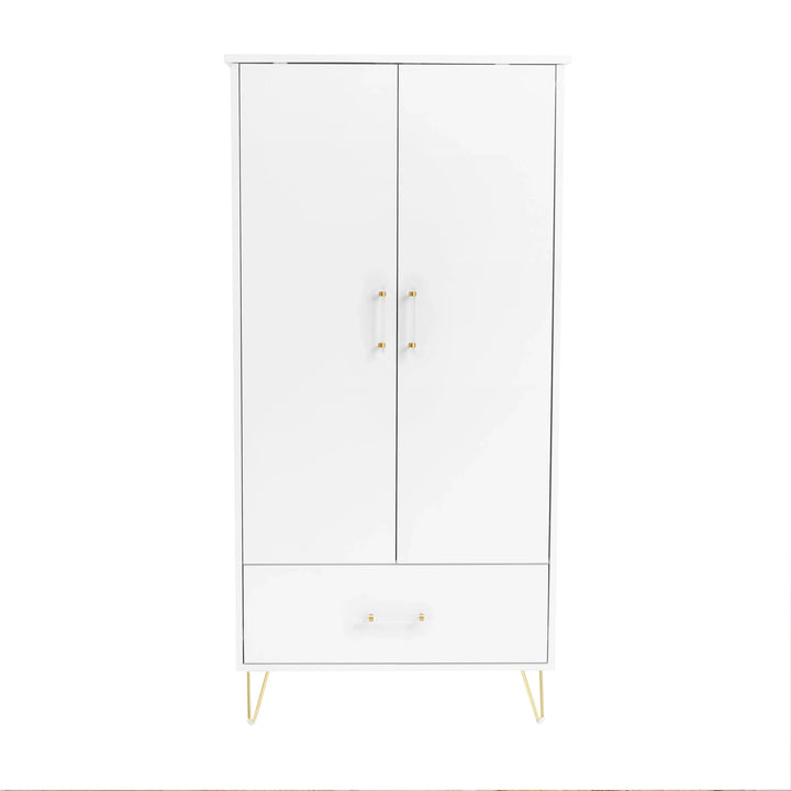 White cabinet with gold legs and handles on a white background