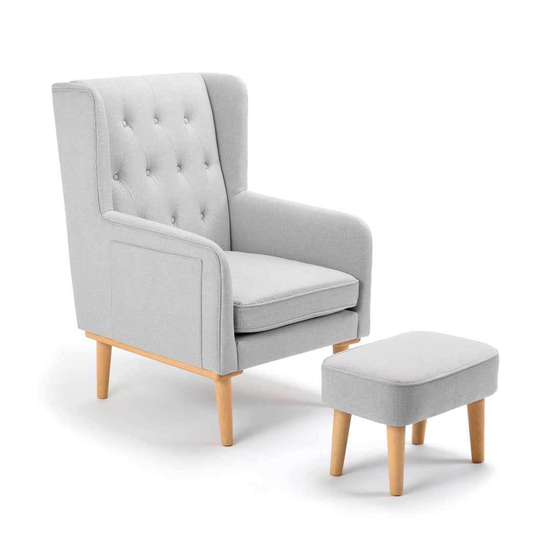 Grey armchair with matching ottoman on a white background