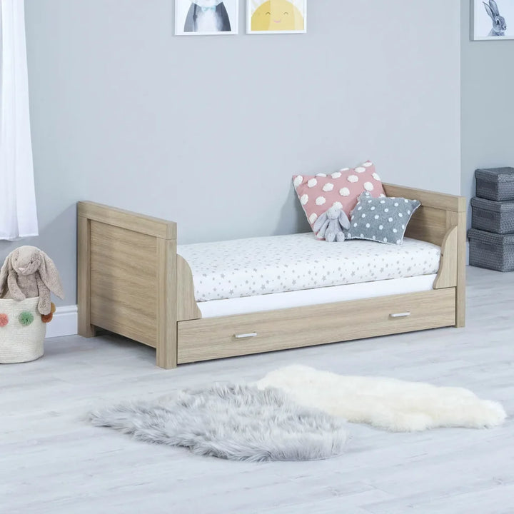 Babymore Luno White Oak Cot Bed with drawer as a toddler bed