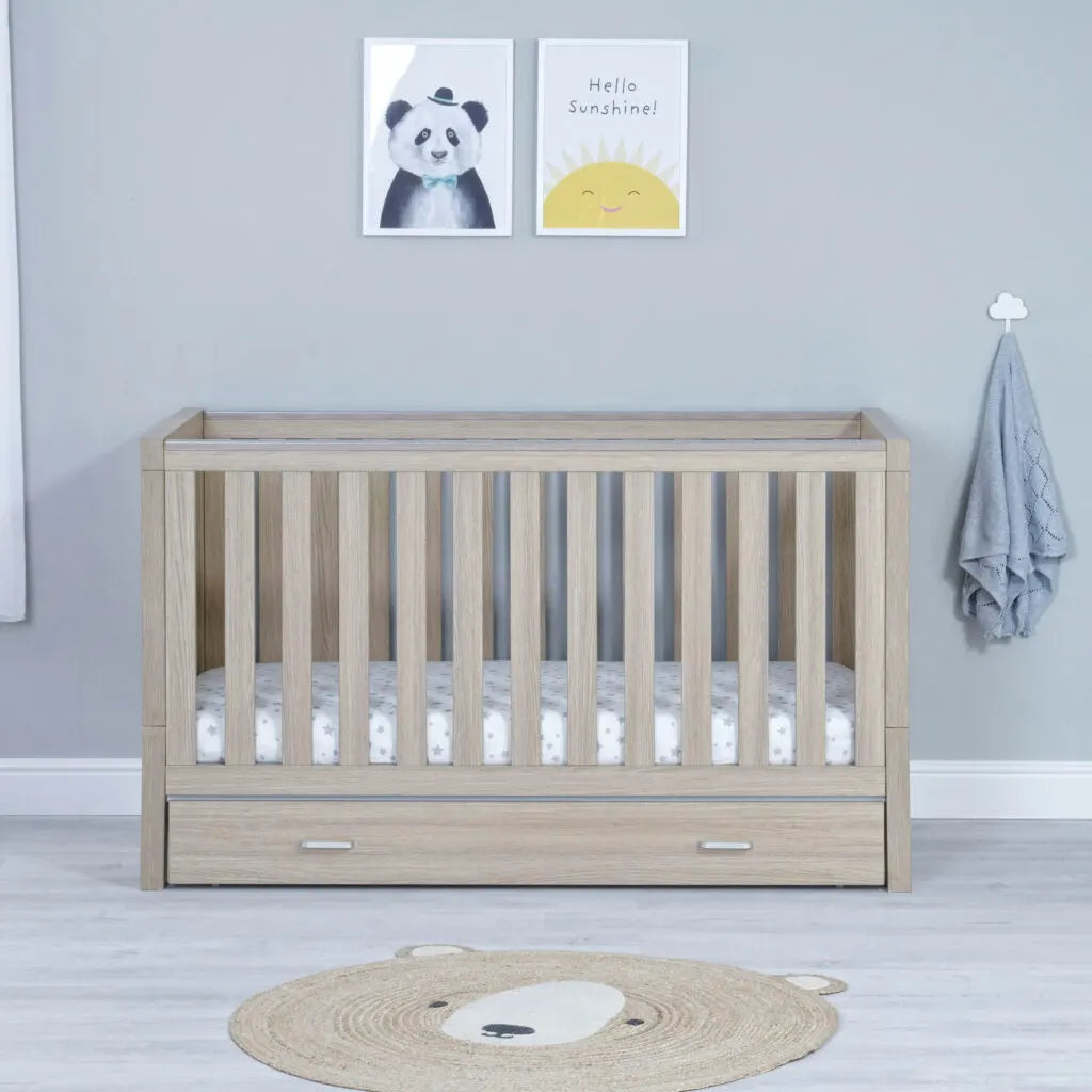 Babymore Luno Cot Bed with drawer in oak lifestyle image