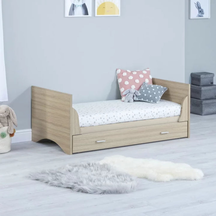 babymore Veni Cot Bed in Oak as toddler bed