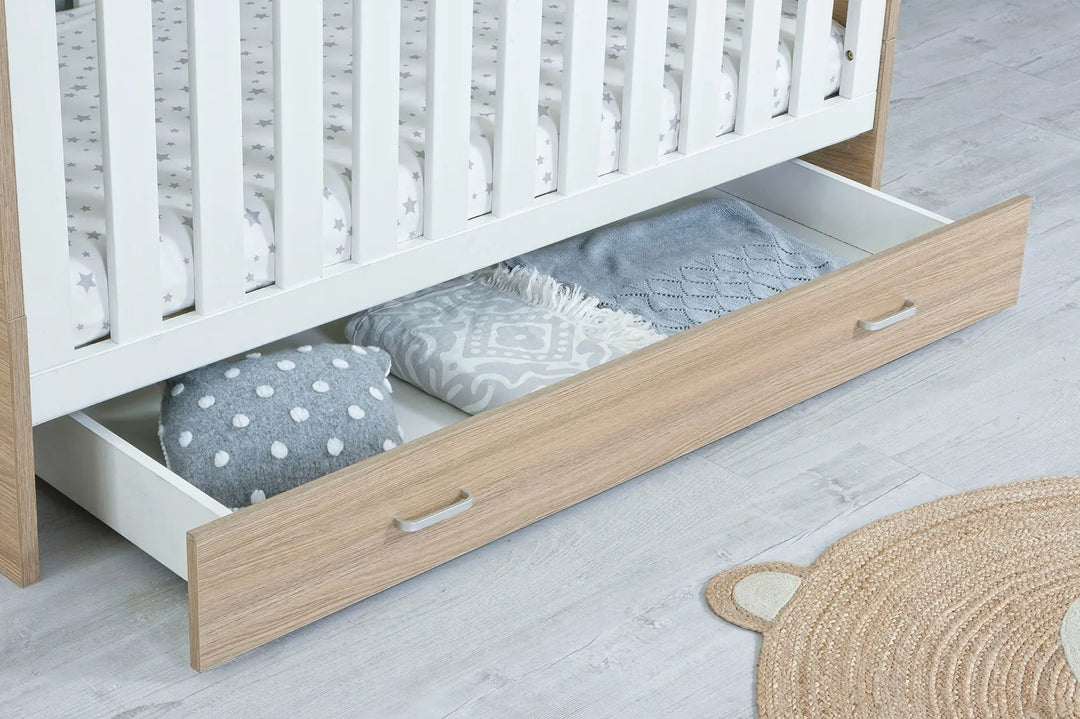 Babymore Veni Cot Bed White Oak under cot drawer close up