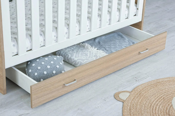 Babymore Veni Cot Bed White Oak under cot drawer close up