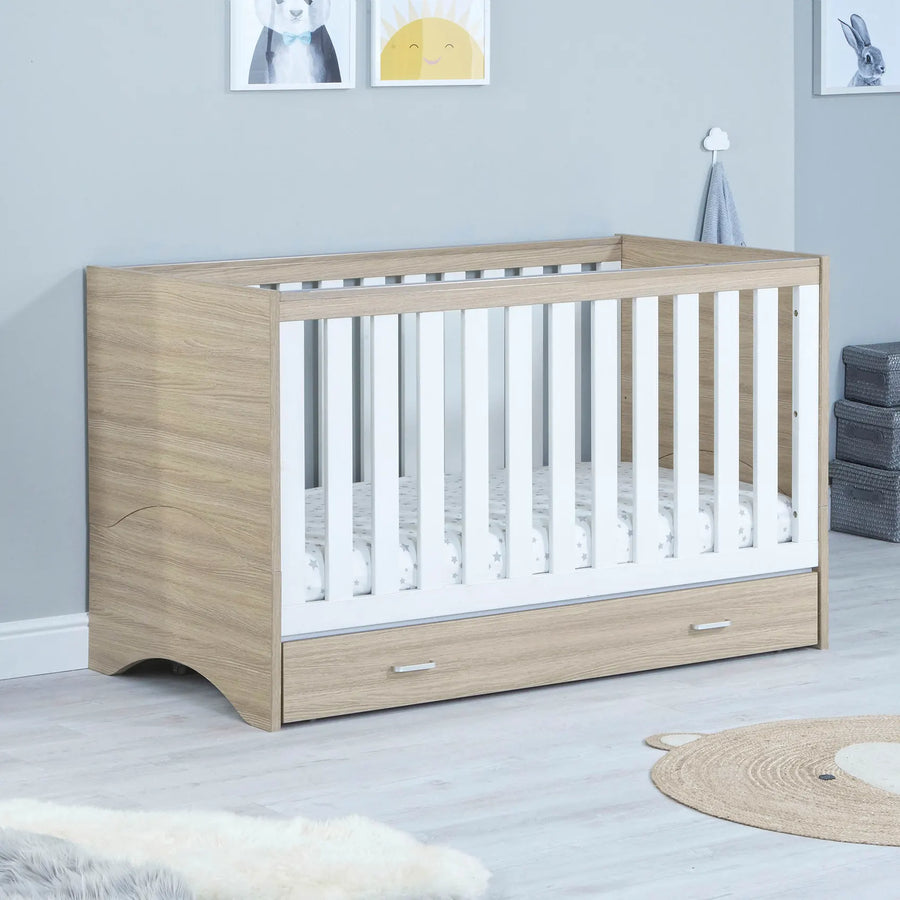 Babymore Veni Cot Bed White Oak with under drawer lifestyle