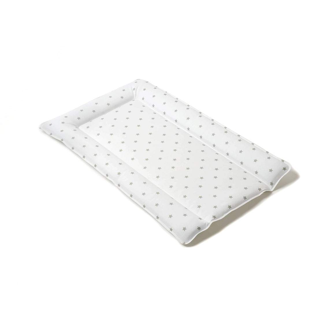 White quilt with small gray patterns on a white background
