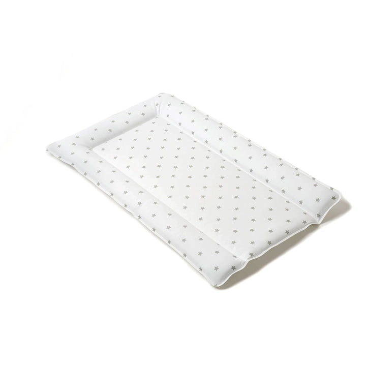 White quilt with small gray patterns on a white background