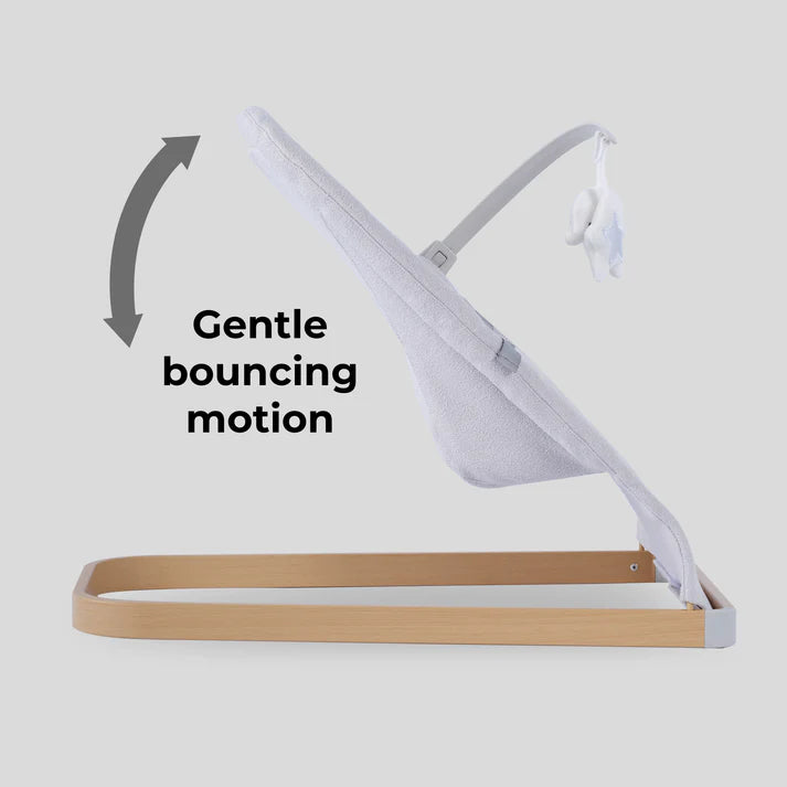 My Babiie Baby Bouncer with toy bar in grey with text 'Gentle bouncing motion' on a light gray background