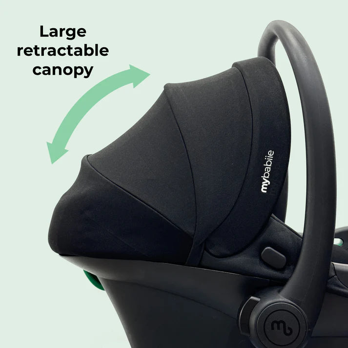 My Babiie I-size infant carrier with large retractable canopy on a light green background