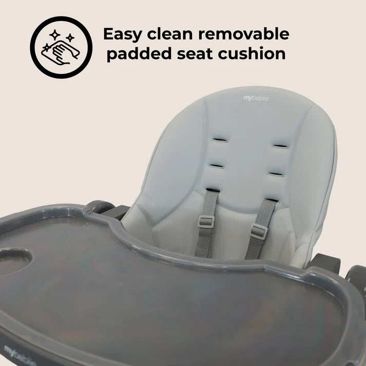 My Babiie Luxe Highchair in Grey with an easy-clean removable padded seat cushion on a light beige background.