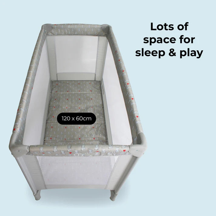 My Babiie Elephants travel cot with dimensions on a light blue background