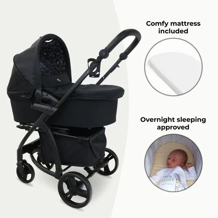 My Babiie MB200i 3 in 1 travel system in black leopard with text indicating a comfy mattress and overnight sleeping approval on a white background.