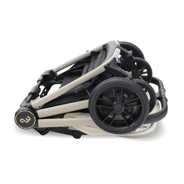 My Babiie MB450i Travel System in Ivory Folded stroller with visible brand logo on a white background