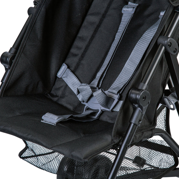Close-up of Red Kite Push Me 2U midnight stroller  with grey straps on a white background