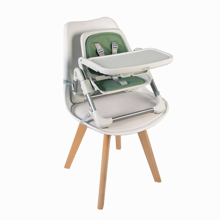 Red Kite Feed Me Nom Nom Booster Seat in Sage attached to chair