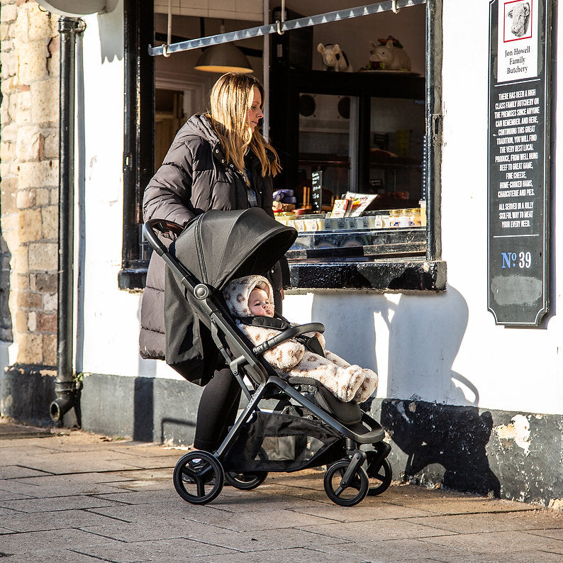 Red Kite Push Me Astro Stroller in Black lifestye image