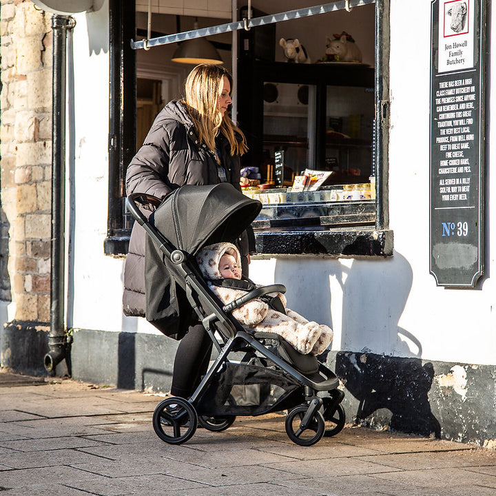 Red Kite Push Me Astro Stroller in Black lifestye image