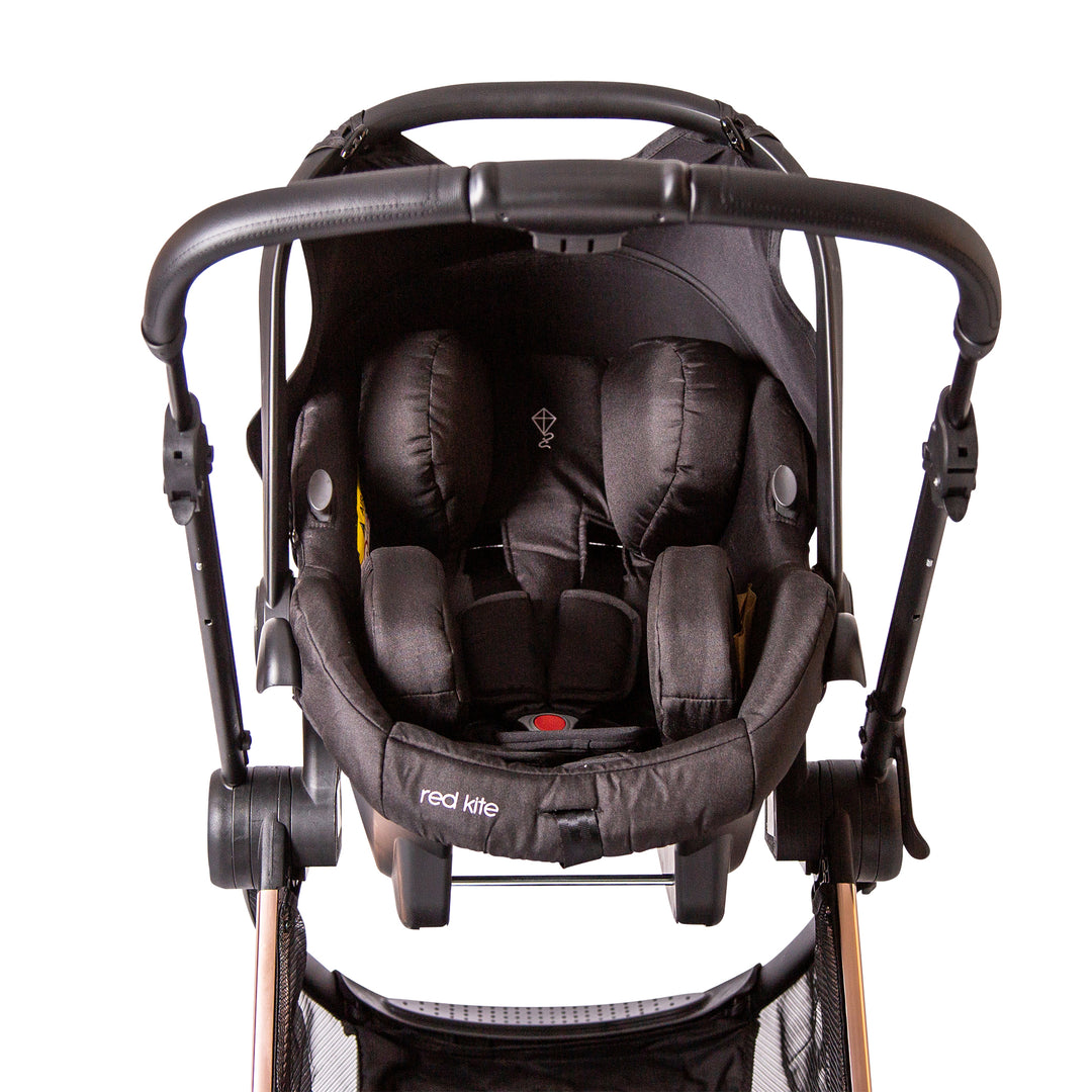 Red Kite Push Me Pace Amber 3 in 1 Travel System with car seat on chassis