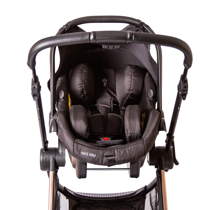 Red Kite Push Me Pace Amber 3 in 1 Travel System with car seat on chassis