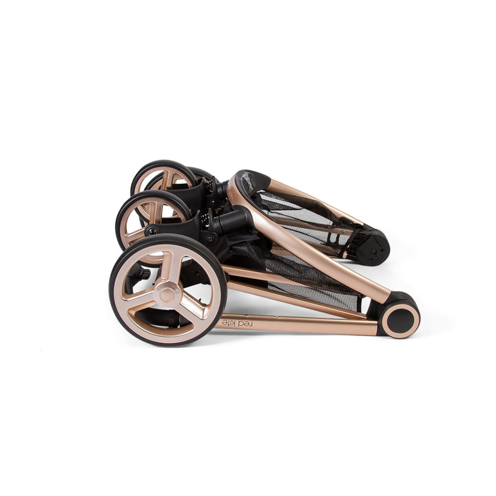 Red Kite Push Me Pace 3 in 1 Travel System in Latte folded chassis
