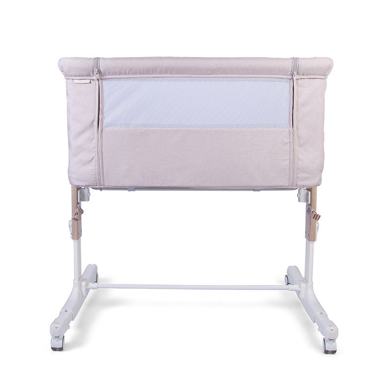 Red Kite Rockabye Bedside Crib with white mattress on a white background