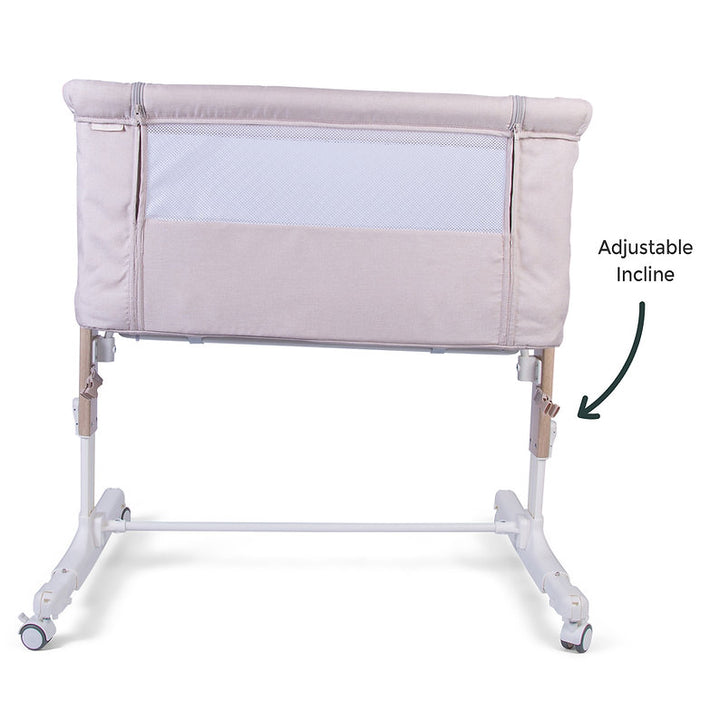 Red Kite Rockabye Bedside Crib with adjustable incline feature on a white background