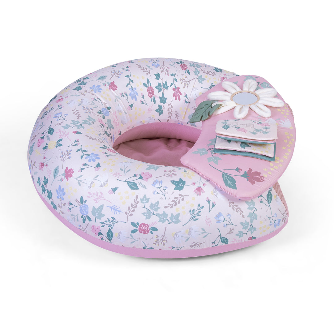 Red Kite Sit Me Up Rose & Ivy Floral-patterned baby seat with pink accents on a white background