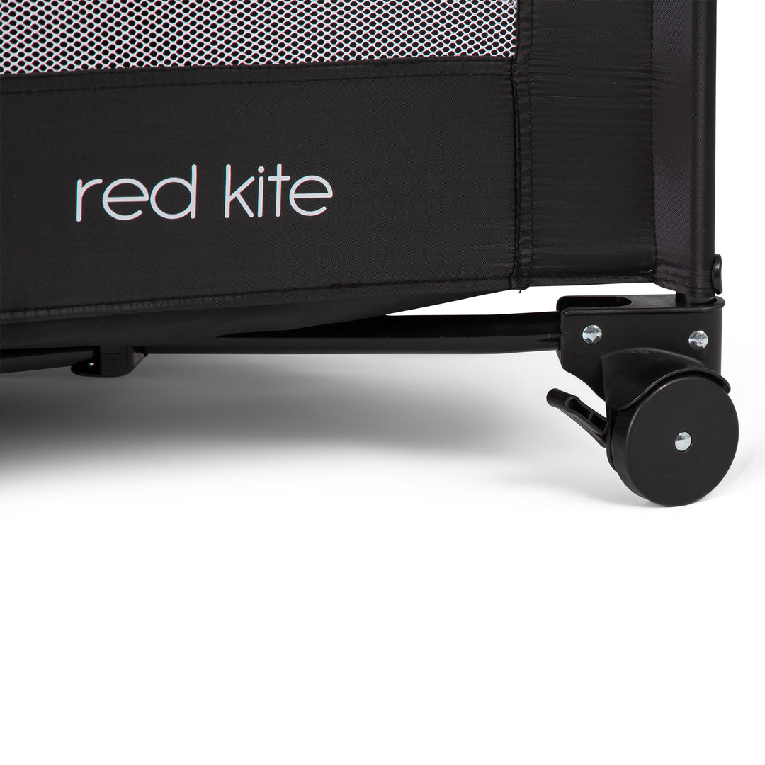 Red Kite Sleeptight Travel Cot in Black wheel detail